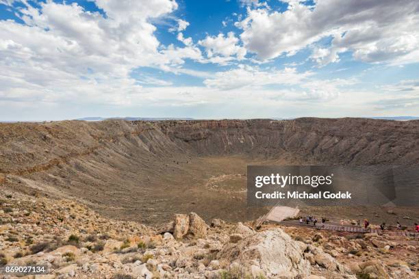 wide angle showing meteor crater impact spot in arizona desert - cratera do meteoro arizona imagens e fotografias de stock