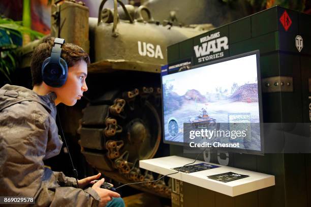 Gamer plays the video game 'World of Tanks : War Stories' developed and published by Wargaming.net on Sony PlayStation game consoles PS4 Pro during...