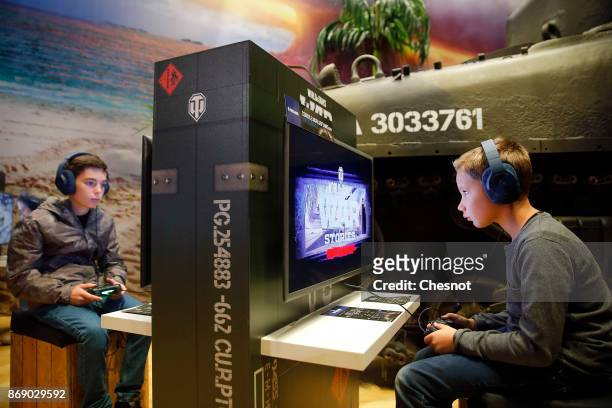 Gamer plays the video game 'World of Tanks : War Stories' developed and published by Wargaming.net on Sony PlayStation game consoles PS4 Pro during...