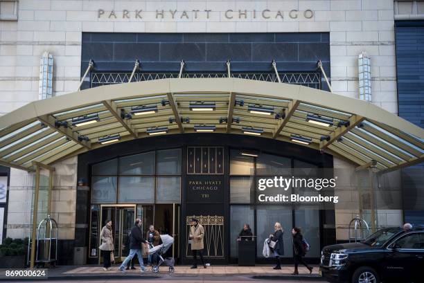 Pedestrians and visitors pass in front of the Park Hyatt hotel in downtown Chicago, Illinois, U.S., on Monday, Oct. 30, 2017. Hyatt Hotels Corp. Is...
