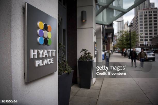 Signage is displayed outside the Hyatt Place hotel in Chicago, Illinois, U.S., on Monday, Oct. 30, 2017. Hyatt Hotels Corp. Is scheduled to release...