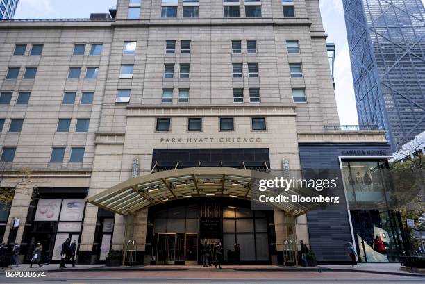 Pedestrians pass in front of the Park Hyatt hotel in downtown Chicago, Illinois, U.S., on Monday, Oct. 30, 2017. Hyatt Hotels Corp. Is scheduled to...