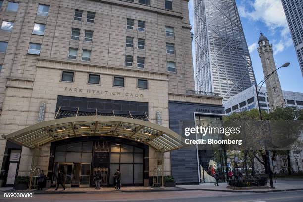 Pedestrians pass in front of the Park Hyatt hotel in downtown Chicago, Illinois, U.S., on Monday, Oct. 30, 2017. Hyatt Hotels Corp. Is scheduled to...