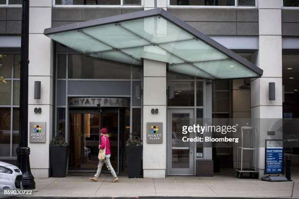 Pedestrian passes in front of the Hyatt Place hotel in Chicago, Illinois, U.S., on Monday, Oct. 30, 2017. Hyatt Hotels Corp. Is scheduled to release...