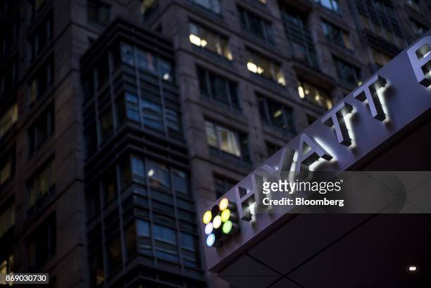 Illuminated signage is displayed outside the Hyatt Place hotel in Chicago, Illinois, U.S., on Monday, Oct. 30, 2017. Hyatt Hotels Corp. Is scheduled...