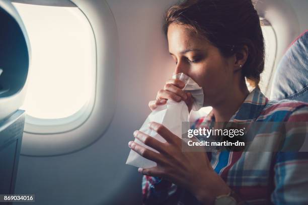 sick woman with nausea in the airplane - fobia imagens e fotografias de stock