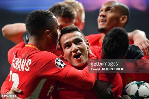 Monaco's Portuguese midfielder Rony Lopes celebrates with teammates after scoring a goal during the UEFA Champions League Group G football match...