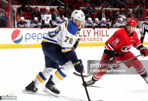 Josh Joorish of the Carolina Hurricanes defends against the Beau Bennett of the St. Louis Blues during an NHL game on October 27, 2017 at PNC Arena...