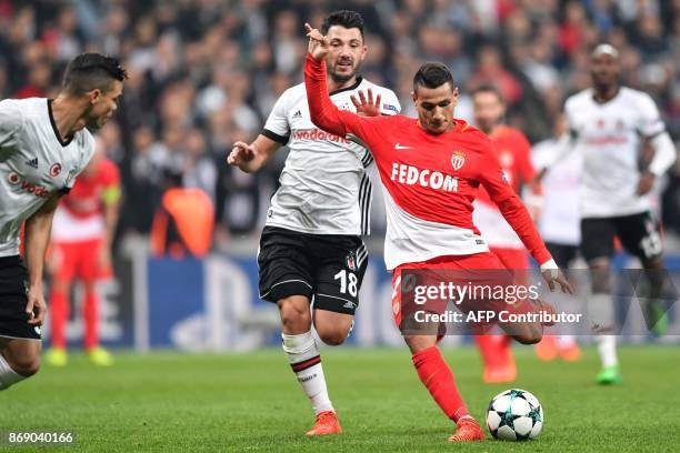 Monaco's Portuguese midfielder Rony Lopes shoots to score as he vies with Besiktas' Turkish midfielder Tolgay Arslan during the UEFA Champions League...