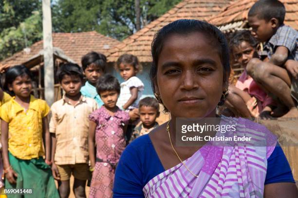 Satia, India Portrait of a woman, behind her are several children, in a rural area about 300 Kilometer from Kolkata.