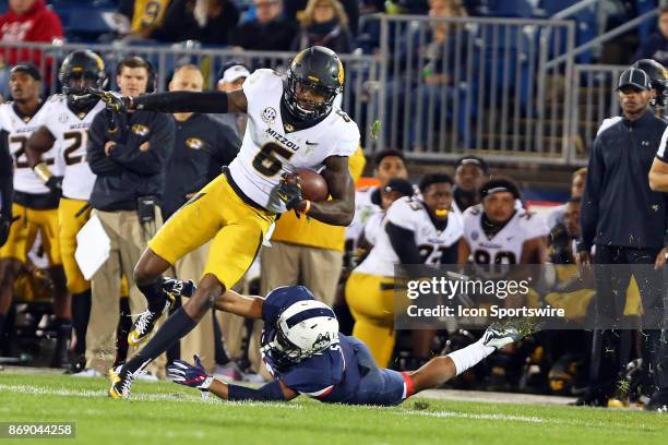 Missouri Tigers wide receiver J'Mon Moore runs with the ball after avoiding a tackle during a college football game between Missouri Tigers and UConn...