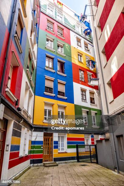 multicolored residential building facade at bilbao, basque country, spain - bilbao stock pictures, royalty-free photos & images