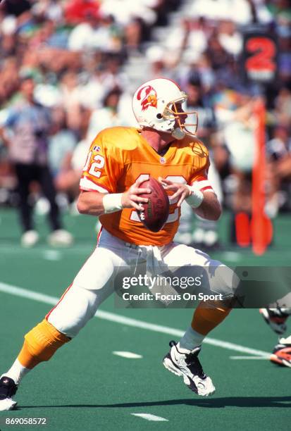 Trent Dilfer of the Tampa Bay Buccaneers drops back to pass against the Philadelphia Eagles during an NFL football game September 3, 1995 at Veterans...