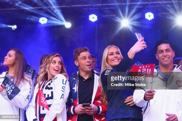Figure skater Ashley Wagner, skier Gus Kenworthy and skier Lindsey Vonn take a selfie during the 100 Days Out 2018 PyeongChang Winter Olympics...