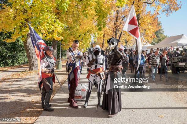 Cosplayers pose during the opening of the Lucca Comics and Games Heroes on November 1, 2017 in Lucca, Italy.