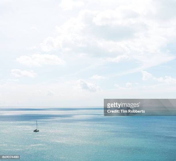 boat on the sea off the coast of devon - seascape horizon bildbanksfoton och bilder