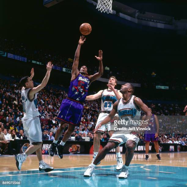Chauncey Billups of the Toronto Raptors shoots against the Vancouver Grizzlies circa 1998 at the General Motors Palace in Vancouver B.C.. NOTE TO...