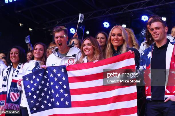 Bobsledder Elana Meyers Taylor, snowboarder Alex Deibold, skier Lindsey Vonn, skier Gus Kenworthy and members of Team USA pose for a photo during the...