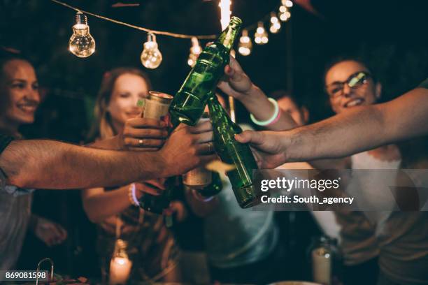 b-day toast - beer bottle cheers stock pictures, royalty-free photos & images