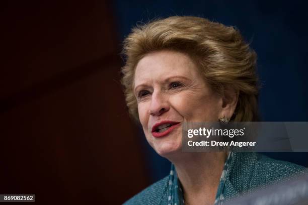 Sen. Debbie Stabenow speaks during a meeting about the GOP tax plan held by the Democratic Policy and Communications Committee on Capitol Hill,...