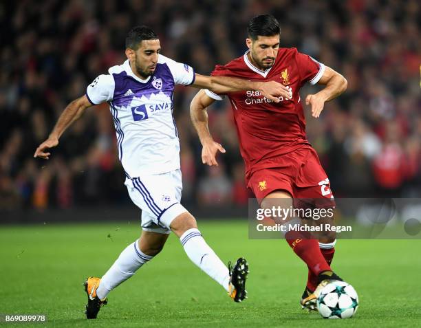 Marwan Kabha of NK Maribor and Emre Can of Liverpool battle for possession during the UEFA Champions League group E match between Liverpool FC and NK...