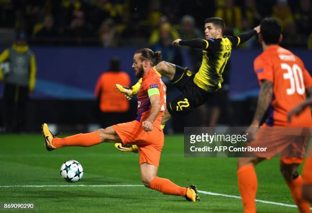 Nicosia's Cypriot midfielder Nektarios Alexandrou and Dortmund's US midfielder Christian Pulisic vie for the ball during the UEFA Champions League...