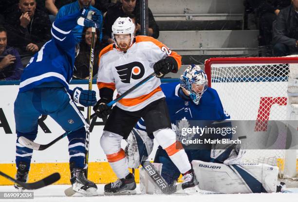 Frederik Andersen of the Toronto Maple Leafs defends the net against Matt Read of the Philadelphia Flyers during the first period at the Air Canada...