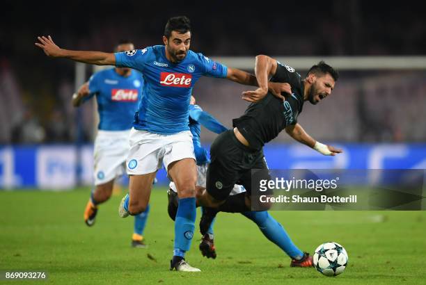 Raul Albiol of SSC Napoli and Sergio Aguero of Manchester City battle for possession during the UEFA Champions League group F match between SSC...