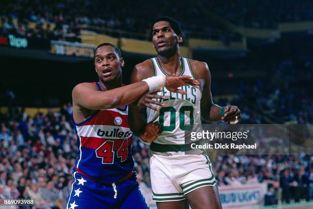 Rick Mahorn of the Washington Bullets defends against Robert Parish of the Boston Celtics circa 1985 at the Boston Garden in Boston, Massachusetts....