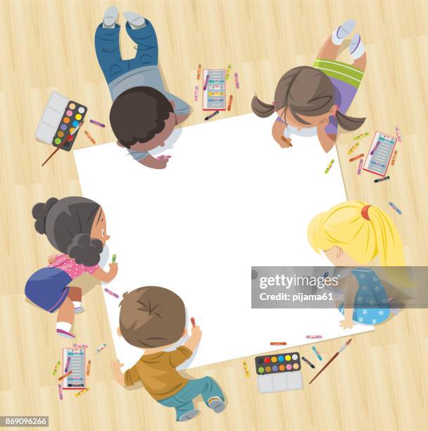 stockillustraties, clipart, cartoons en iconen met kinderen trekken samen op een groot vel papier - jongens