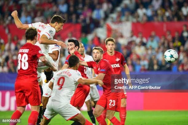 Sevilla's French defender Clement Lenglet scores a header during the UEFA Champions League group E football match between Sevilla and Spartak Moscow...