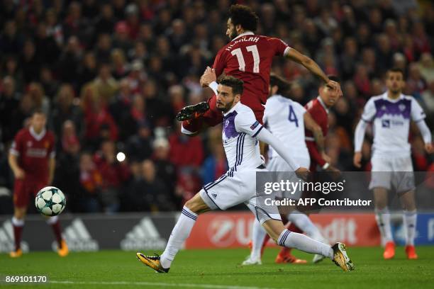 Liverpool's Egyptian midfielder Mohamed Salah scores the opening goal of the UEFA Champions League Group E football match between Liverpool and NK...