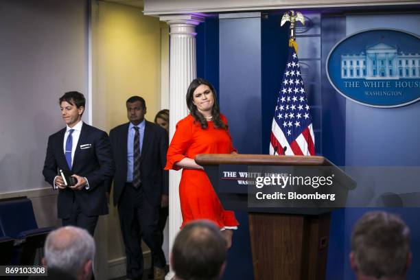 Sarah Huckabee Sanders, White House press secretary, right, and Hogan Gidley, White House deputy press secretary, left, arrive to speak during a...