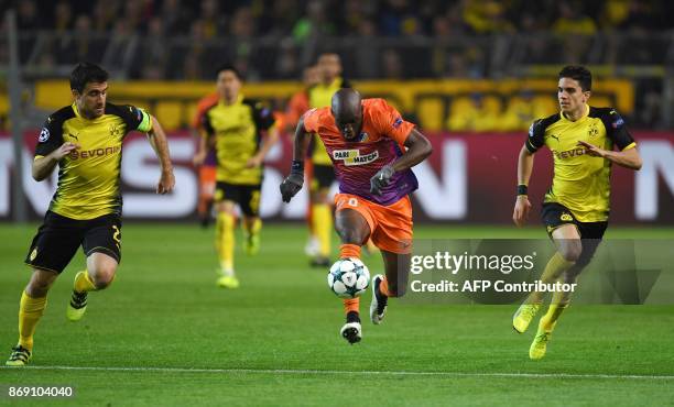 Nicosia's Mickael Pote runs with the ball during the UEFA Champions League Group H football match BVB Borussia Dortmund v Apoel Nicosia on November...