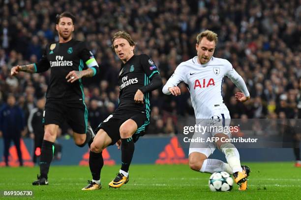 Tottenham Hotspur's Danish midfielder Christian Eriksen shoots to score their third goal during the UEFA Champions League Group H football match...