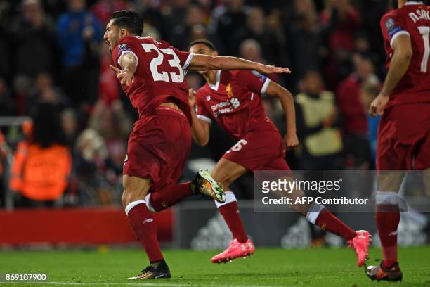 Liverpool's German midfielder Emre Can celebrates after scoring their second goal during the UEFA Champions League Group E football match between...