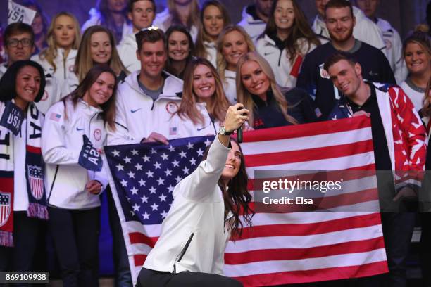 Ice hockey player Hilary Knight poses for a Team USA selfie during the 100 Days Out 2018 PyeongChang Winter Olympics Celebration in Times Square on...
