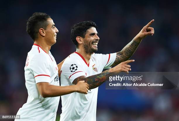 Ever Banega of Sevilla FC celebrates after scoring the second goal for Sevilla FC with Wissam Ben Yedder of Sevilla FC during the UEFA Champions...
