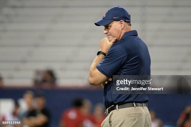 Head coach Rich Rodriguez of the Arizona Wildcats looks on during warm ups prior to the game against the Washington State Cougars at Arizona Stadium...