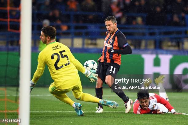 Shakhtar's Ukrainian midfielder Marlos shoots and scores a goal past Feyenoord's Australian goalkeeper Brad jones during the UEFA Champions League...