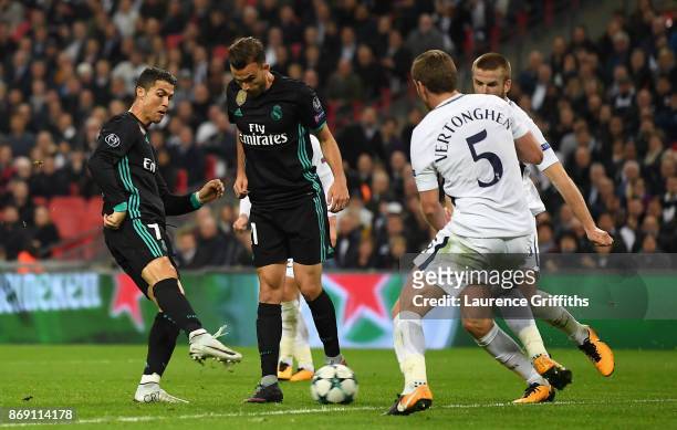 Cristiano Ronaldo of Real Madrid scores his side's first goal during the UEFA Champions League group H match between Tottenham Hotspur and Real...