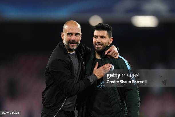 Josep Guardiola, Manager of Manchester City and Sergio Aguero of Manchester City embrace after the UEFA Champions League group F match between SSC...