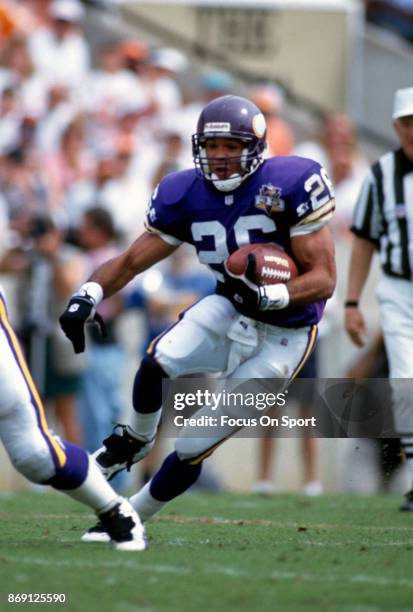 Robert Smith of the Minnesota Vikings carries the ball against the Tampa Bay Buccaneers during an NFL football game October 15, 1995 at Tampa Stadium...