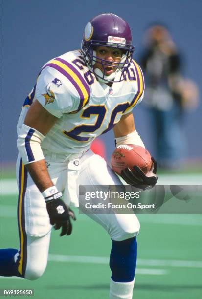 Robert Smith of the Minnesota Vikings carries the ball against the New York Giants during an NFL football game September 29, 1996 at Giants Stadium...