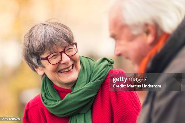 happy conversation - active senior couple stock pictures, royalty-free photos & images