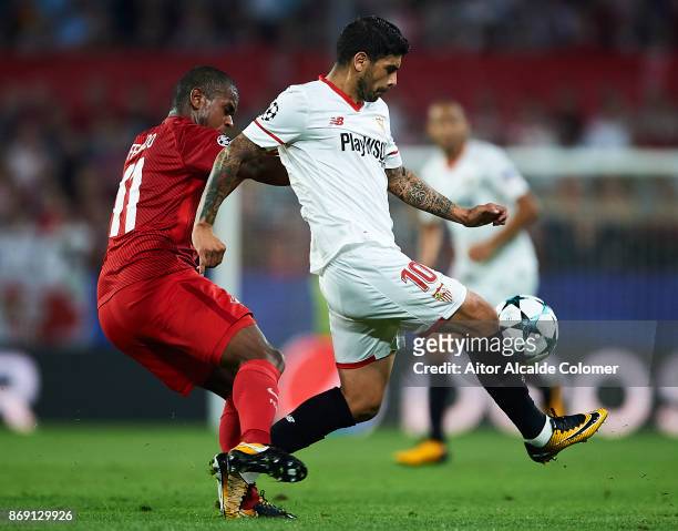 Fernando Lucas Martins of FC Spartak Moskva competes for the ball with Ever Banega of Sevilla FC during the UEFA Champions League group E match...