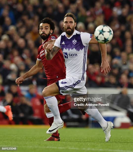 Mohamed Salah of Liverpool competes with Marko Suler of NK Maribor during the UEFA Champions League group E match between Liverpool FC and NK Maribor...