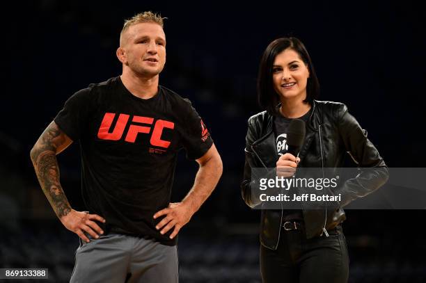Dillashaw and UFC host Megan Olivi interact with fans and media during an open workout session inside Madison Square Garden on November 1, 2017 in...