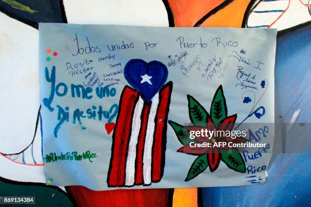 Banner with a positive messages made by the people staying at a shelter is seen at the school lobby in Barranquitas, Puerto Rico October 31, 2017....