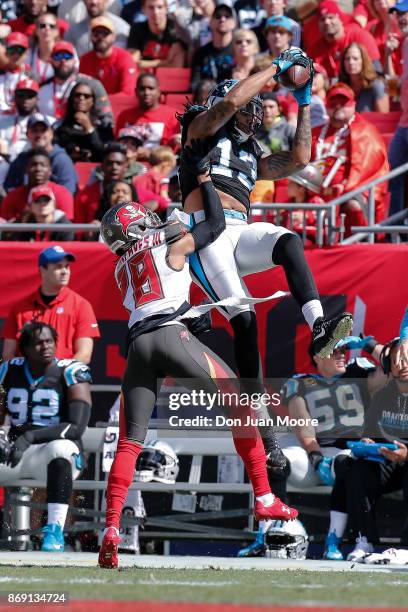 Wide Receiver Kelvin Benjamin of the Carolina Panthers makes a catch out of bounce against Cornerback Vernon Hargreaves of the Tampa Bay Buccaneers...